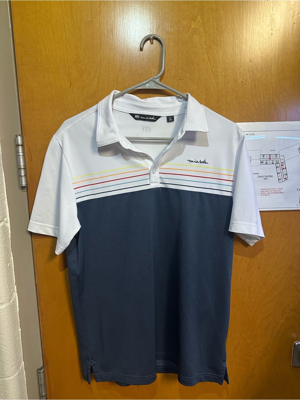 Travis Mathew White and Navy Colorblock Polo with Multicolor Chest Stripes